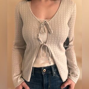 NIKKA K CARDIGAN WITH TWO BOWS AND FLORAL MATERIAL